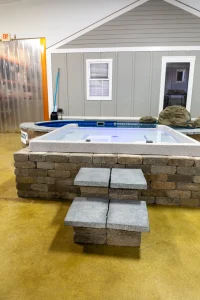 Display showroom featuring above ground pools and hot tubs for Cincinnati backyard living