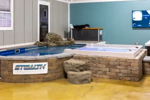 Stealth brand above ground pool and hot tub spa display at Cincinnati pools retailer showroom
