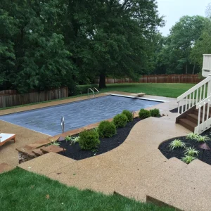 Professional backyard pool installation with patio deck and landscaping in Cincinnati