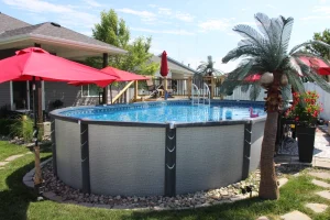 Above ground pool with brick-pattern walls in residential backyard outdoor living space