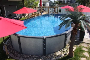 Above ground pool with pink umbrellas and palm trees in Cincinnati backyard