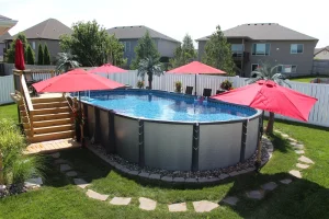 Above ground pool with red umbrellas and wooden deck in Cincinnati backyard