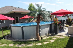 Above ground pools with red umbrellas in Cincinnati backyard outdoor living space