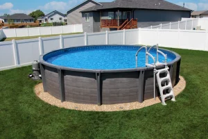 Above ground pool with gray frame in Cincinnati backyard surrounded by white fence
