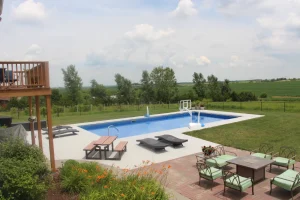 Backyard pool with patio furniture and outdoor living space in Cincinnati area
