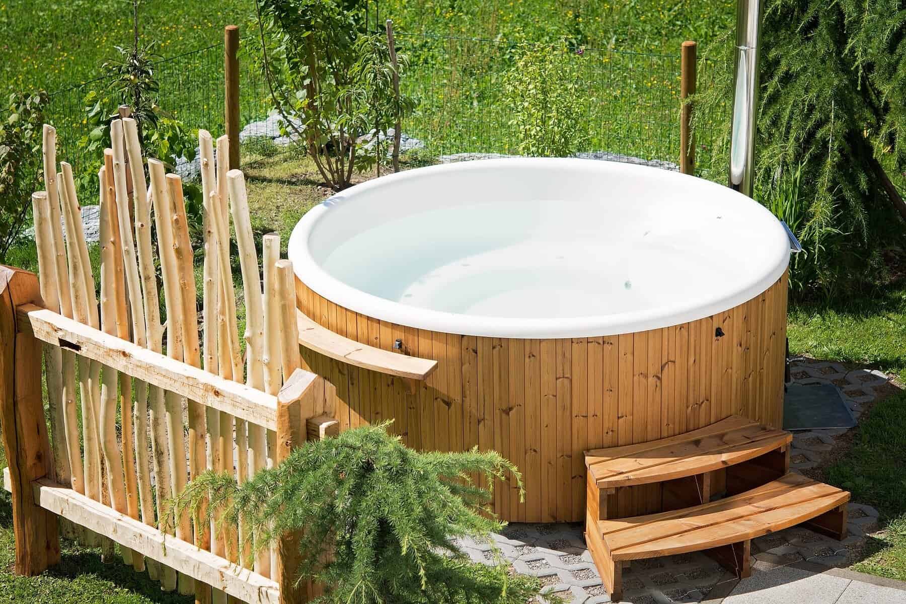 Backyard hot tub at dusk - Cincinnati Pool & Patio