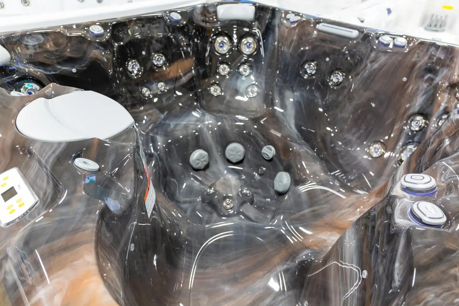 Wellis Lima hot tub with a marbled shell and stainless jets in the Cincinnati Pool and Patio showroom
